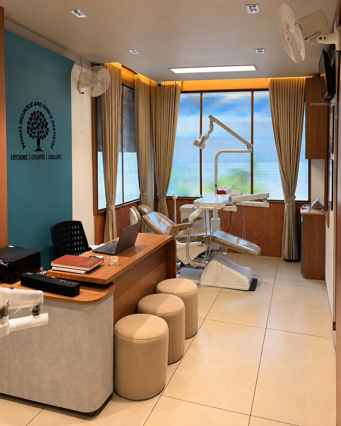 Sunlit consultation desk and dental chair at Thanal Dental Clinic